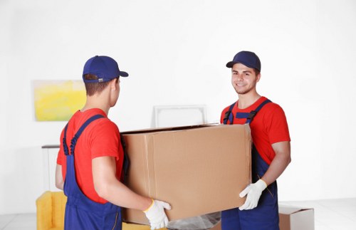 Apartment movers handling stairs and tight access during a Watford flat removal