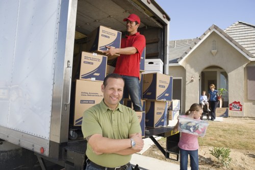 Local removals team handling furniture in Watford