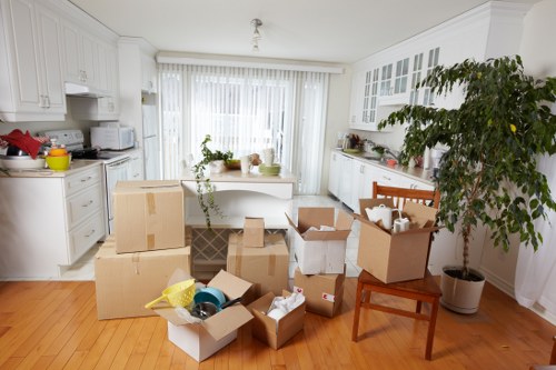 Packed moving boxes and furniture prepared for removals in Watford