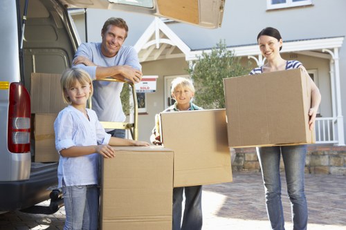 Residential removals team handling household items in Watford