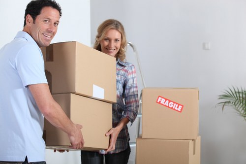 Professional movers handling furniture during a Watford house move
